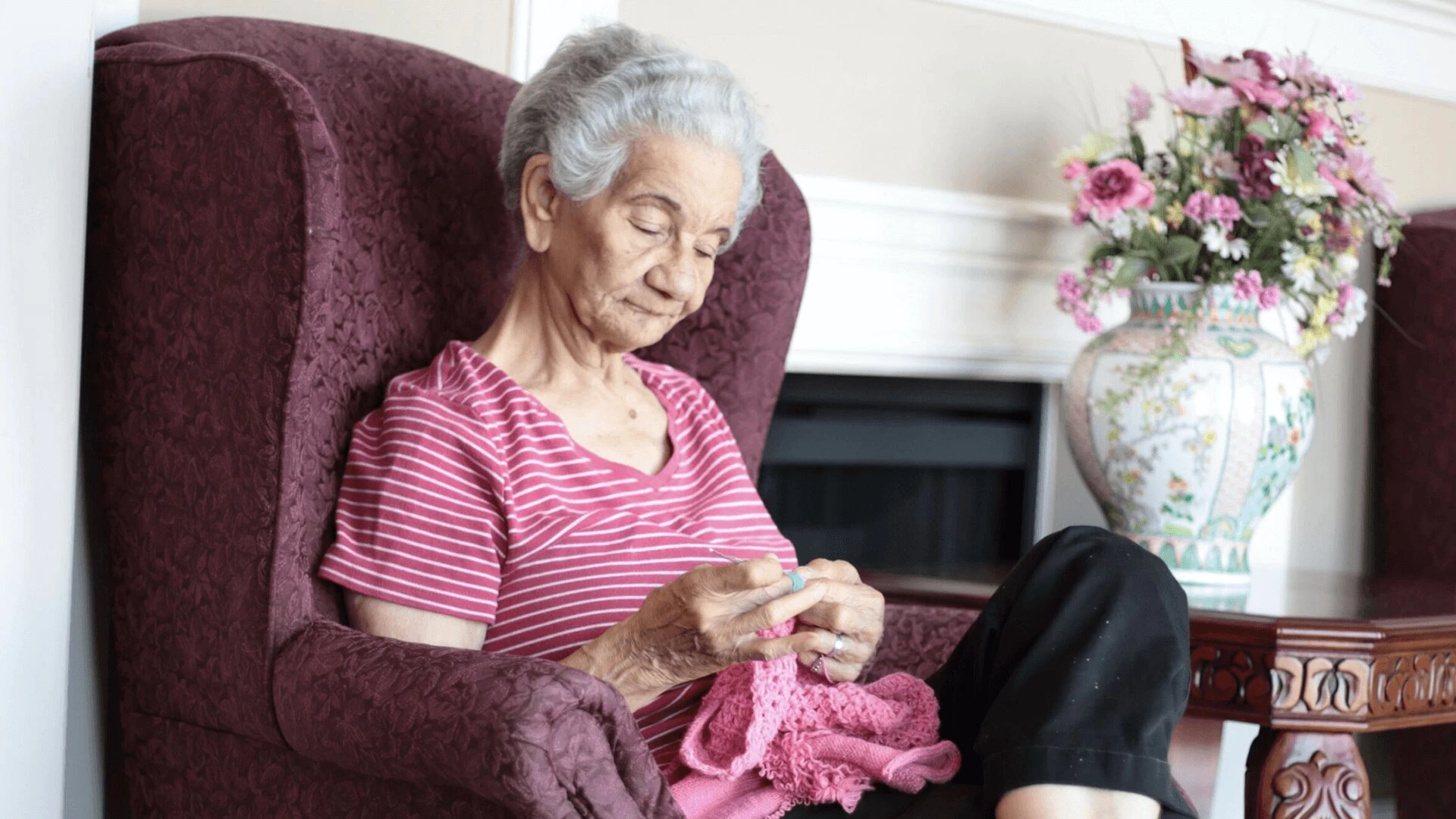 An elderly lady knitting at RCG